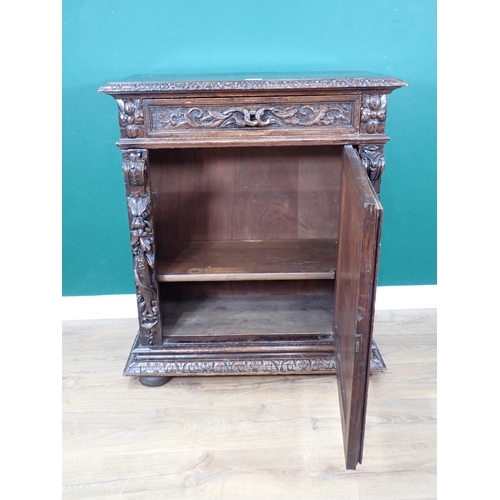 40 - A 19th Century Continental carved oak Cupboard fitted single frieze drawer above single door 3ft 3in... 