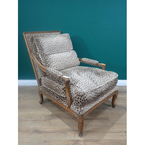 447 - A French beechwood framed open Easy Chair with animal print upholstery