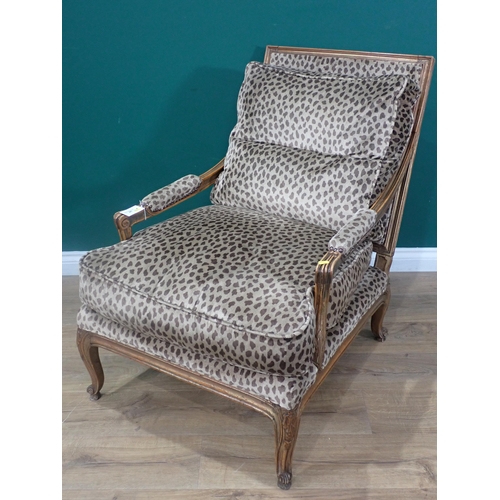 447 - A French beechwood framed open Easy Chair with animal print upholstery