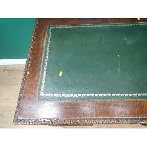 46 - A Victorian oak Pedestal Desk by Edwards & Roberts fitted with nine green man carved drawers 4ft 6in... 