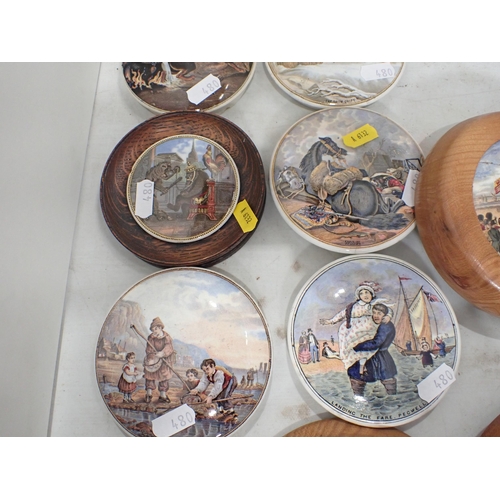 480 - A quantity of Prattware Pot Lids, some in ebonised and wooden frames, some A/F and a pair of Prattwa... 