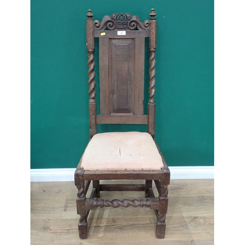 49 - An oak Hall Chair in the Carolean style and two reproduction oak Box Stools