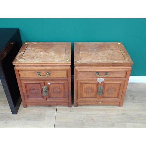 50 - A pair of Chinese hardwood Cupboards each fitted single frieze drawer with George Zee & Co. labels t... 