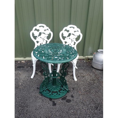 556A - Two heavy white painted metal Garden Chairs with rose design and a green painted metal Garden Table