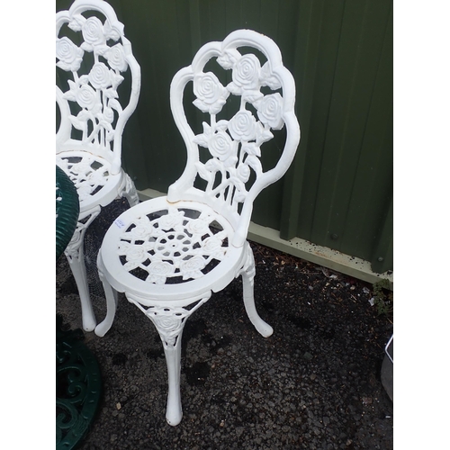 556A - Two heavy white painted metal Garden Chairs with rose design and a green painted metal Garden Table