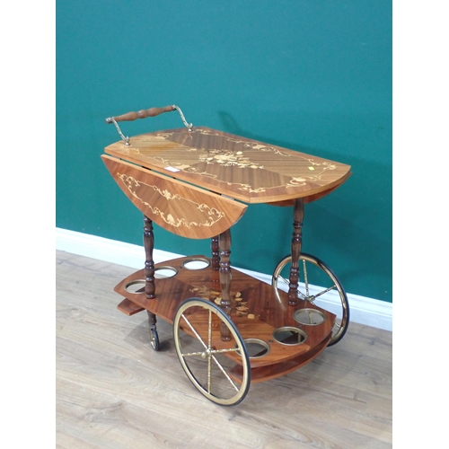 57 - A walnut veneered and inlaid two tier Trolley