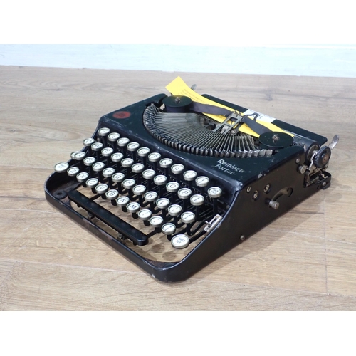 571 - A Remington Portable Typewriter c.1924, Serial No. NX40048. This was the first four-row keyboard por... 