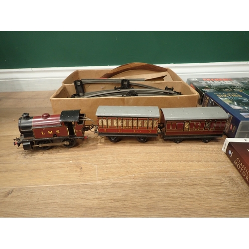 590 - A Hornby 0 gauge clockwork 0-4-0 Locomotive, two Coaches, a quantity of Track and various Railway Vi... 