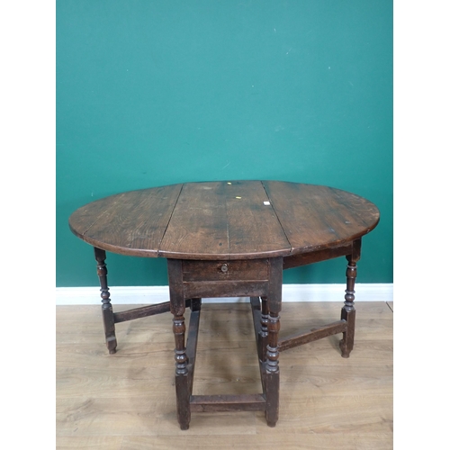 603 - An 18th Century oak Gateleg Table fitted end drawer mounted upon turned supports 3ft 4in W x 2ft 4in... 