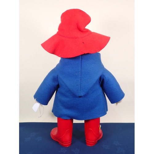 61 - A Paddington Bear with red hat, blue jacket, the red wellington boots marked Film Fair Ltd, 19in