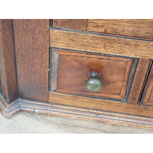 630 - An antique mahogany hanging Corner Cupboard fitted pair of panelled doors above a drawer and two dum... 