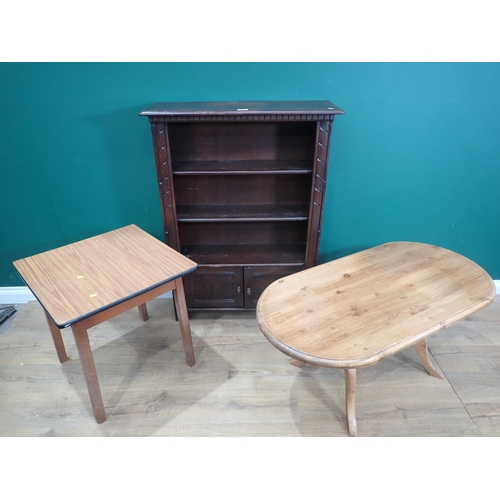 650 - An Ercol style Bookcase, a pine Coffee Table and a melamine Coffee Table