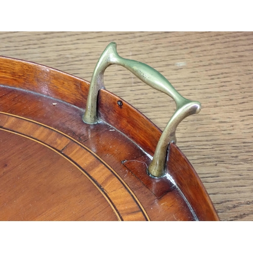 656 - A 19th Century oval mahogany Tray with satinwood musical instrument inlay and crossbanding 2ft 3in W