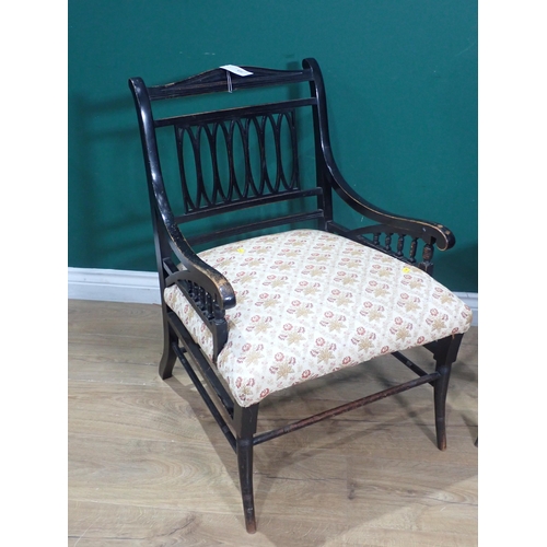 673 - An ebonised Elbow Chair and a Victorian ebonised, painted Single Chair and an oak framed leather Fir... 