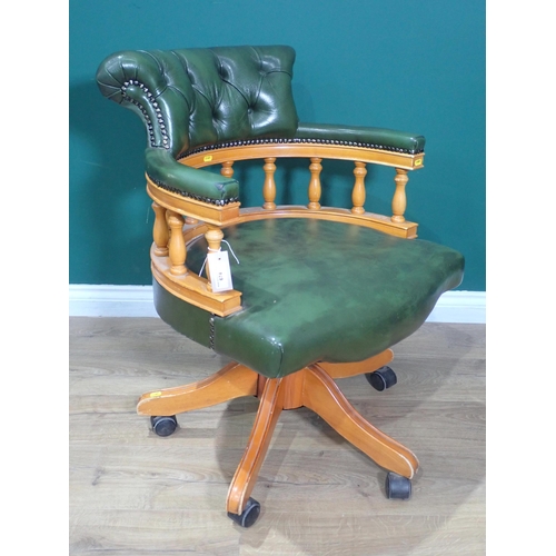 674 - A swivel Office Chair with green leather button upholstery