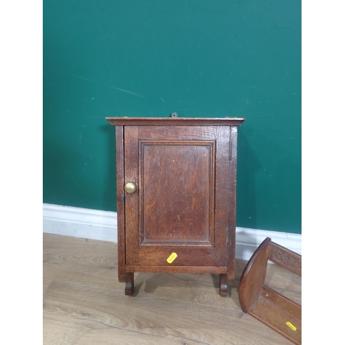 675 - A small Cabinet with single door and a Book Trough