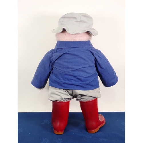 69 - A Paddington Bear, possibly Gabrielle design, with blue jacket and red Dunlop wellingtons, 21in