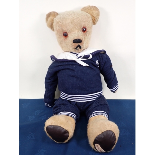 70 - An old jointed Teddy Bear with amber and glass eyes, 20in, repaired and worn and three old Teddy Bea... 