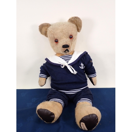 70 - An old jointed Teddy Bear with amber and glass eyes, 20in, repaired and worn and three old Teddy Bea... 