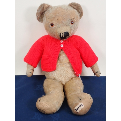 70 - An old jointed Teddy Bear with amber and glass eyes, 20in, repaired and worn and three old Teddy Bea... 