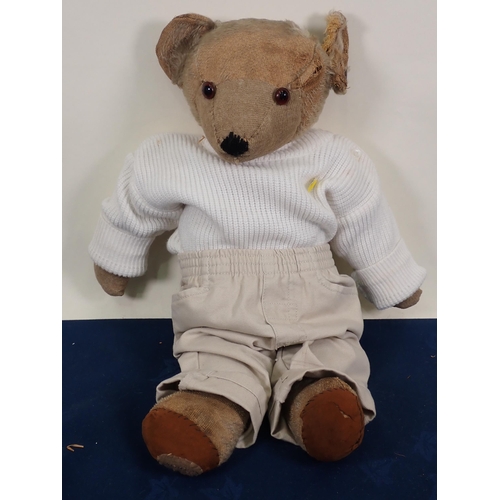 70 - An old jointed Teddy Bear with amber and glass eyes, 20in, repaired and worn and three old Teddy Bea... 