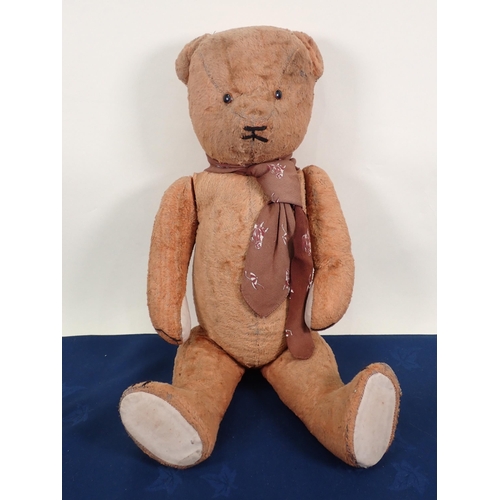 70 - An old jointed Teddy Bear with amber and glass eyes, 20in, repaired and worn and three old Teddy Bea... 