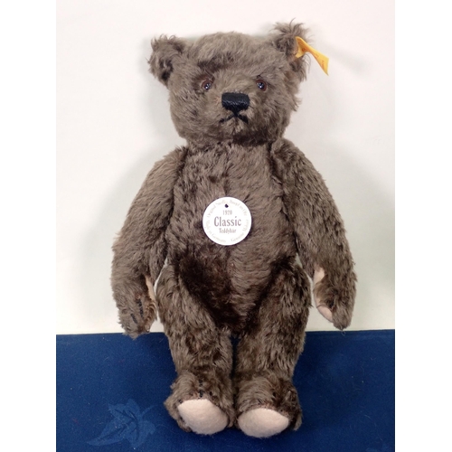 71 - A Steiff jointed Tabby Cat with button, 8in, a Steiff jointed Teddy Bear, button and tag to ear 10in... 