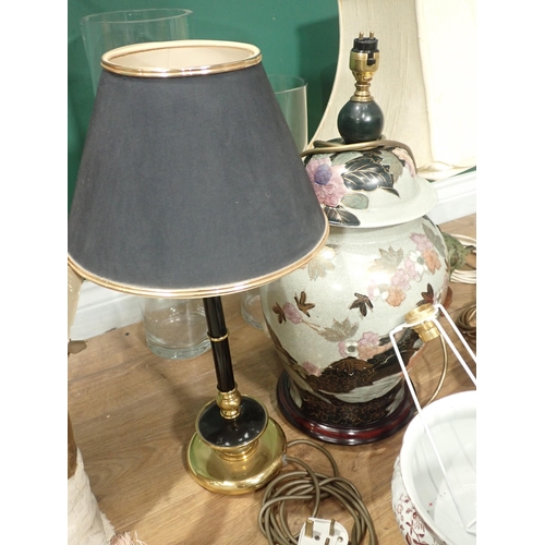 712 - A quantity of Table Lamps, (failed PAT), Light Shades and a roll of material