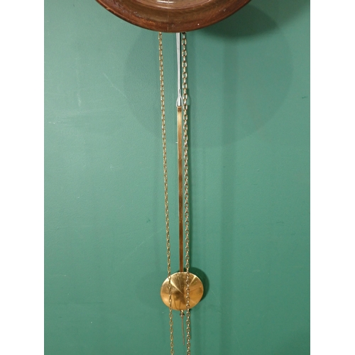 740 - A circular Wall Clock with pine cone weights