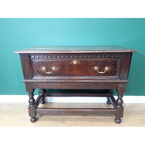 741 - An oak Side Table in the 17th Century style fitted single deep drawers mounted upon turned supports ... 