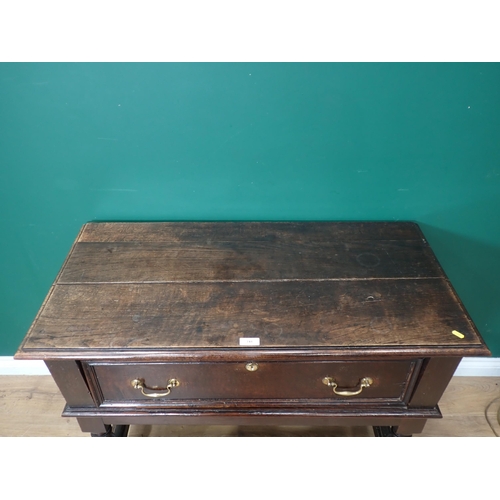 741 - An oak Side Table in the 17th Century style fitted single deep drawers mounted upon turned supports ... 