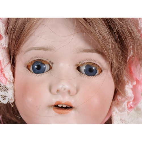 75 - A Schoenau and Hoffmeister bisque headed Doll, marked 1909, with sleeping eyes, open mouth and teeth... 