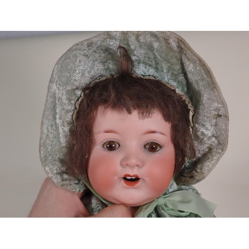 78 - A Armand Marseille bisque-headed Doll with open mouth, sleeping eyes, and
composition body, wearing ... 