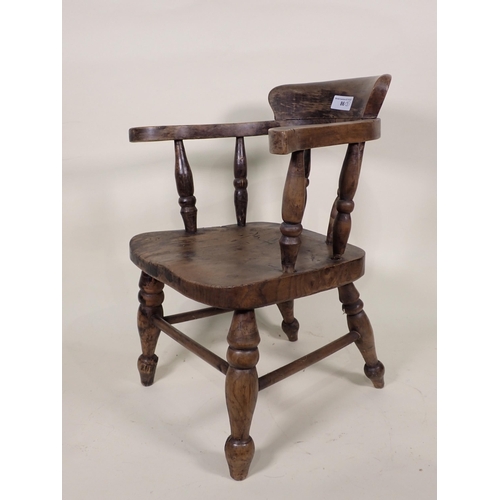 86 - A Doll's/Child's Captain's Chair, an elm Commode Elbow Chair and another with spindle back