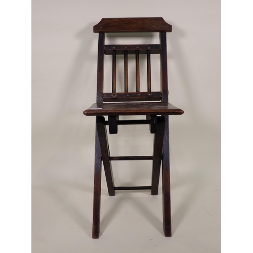 87 - A Doll's/Child's Elbow with cane seat, a folding Chair and a Doll's High Chair