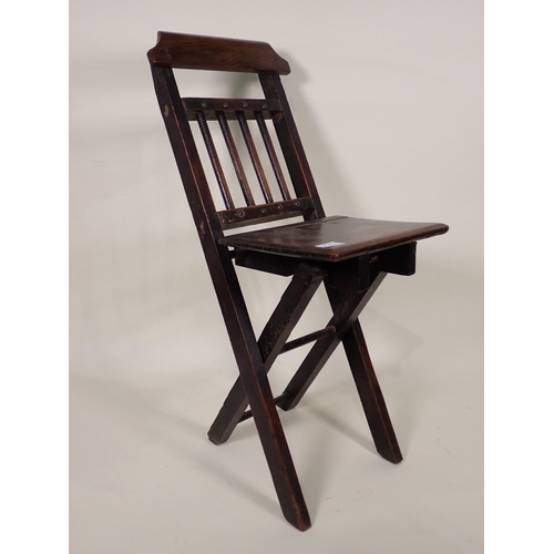 87 - A Doll's/Child's Elbow with cane seat, a folding Chair and a Doll's High Chair