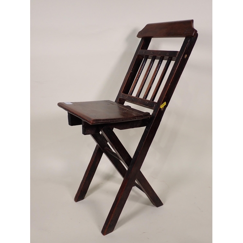 87 - A Doll's/Child's Elbow with cane seat, a folding Chair and a Doll's High Chair