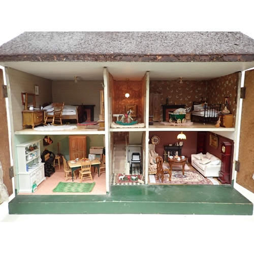 88 - A Doll's House in the style of timber and brick, with hinged doors and containing large large quanti... 