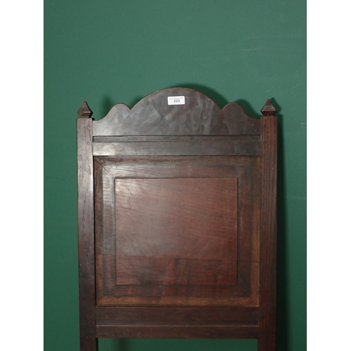 223 - A pair of late 17th Century oak panel back Chairs with solid seats on turned and square front legs