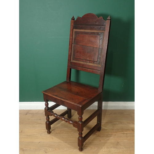 223 - A pair of late 17th Century oak panel back Chairs with solid seats on turned and square front legs