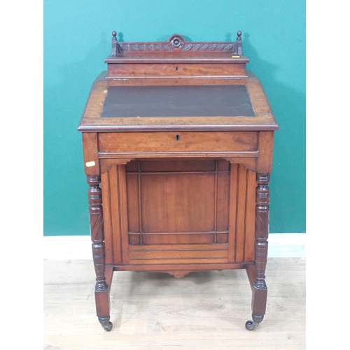 687 - A late Victorian Davenport Desk, fitted cupboard door to the side enclosing drawers and raised on ca... 