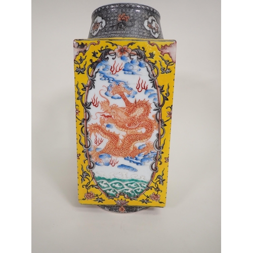 404A - A Chinese square section Vase painted iron red dragons amongst clouds, yellow ground surround, circu... 