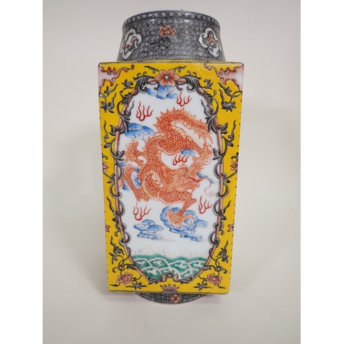 404A - A Chinese square section Vase painted iron red dragons amongst clouds, yellow ground surround, circu... 