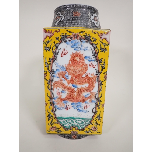 404A - A Chinese square section Vase painted iron red dragons amongst clouds, yellow ground surround, circu... 