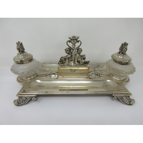 110 - A Victorian silver Inkstand of shaped rectangular form fitted two frosted glass inkwells with silver... 