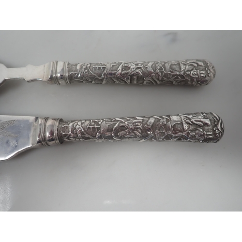 111 - A pair of Chinese silver Fish Servers, marked for Luen Wo, Shanghai, both with hollow cast handles, ... 