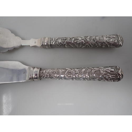 111 - A pair of Chinese silver Fish Servers, marked for Luen Wo, Shanghai, both with hollow cast handles, ... 