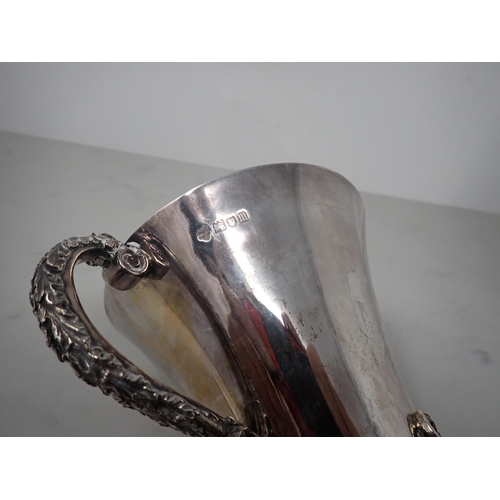 118 - An Edward VII heavy silver two-handled Cup of flared form with leafage scroll handles, applied leafa... 