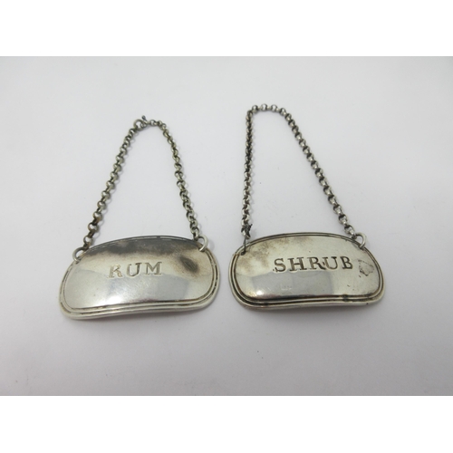 14 - A pair of George III silver oval Labels, Rum and Shrub, Sheffield 1817, maker: Kirkby, Waterhouse & ... 