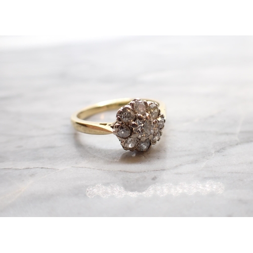 246 - A Diamond Cluster Ring claw-set old-cut stone within eight smaller stones in 18ct gold, ring size N ... 